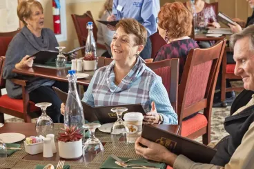 a woman holding a menu